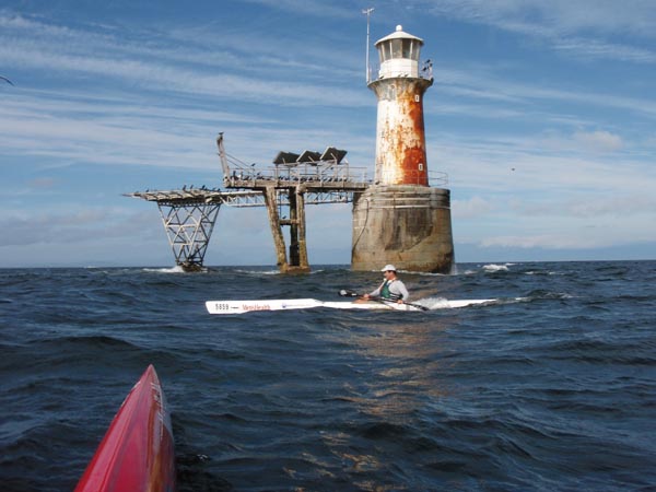 Damian cruises past Roman Rock lighthouse