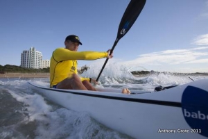Hank McGregor - resplendent in the Dunlop WC stripe heads out through the surf