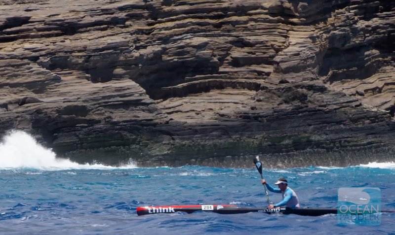 Sean Rice paddles past China Wall near the finish of the 2017 Molokai Challenge