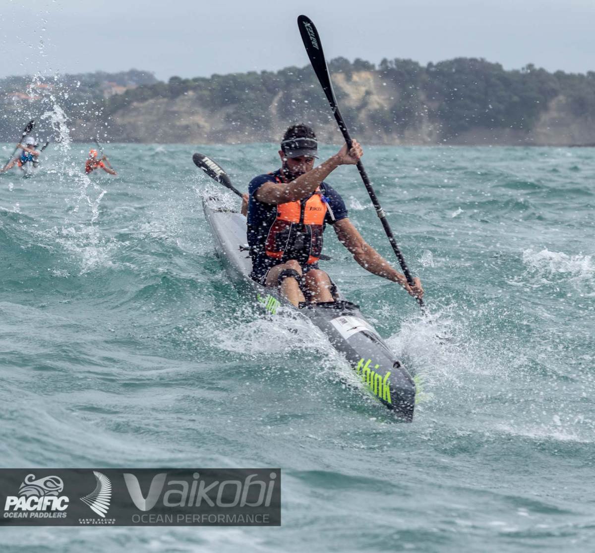 Andy Mowlem crashes over a wave on the upwind leg of the 2019 Vaikobi King and Queen of the Harbour in Auckland, New Zealand